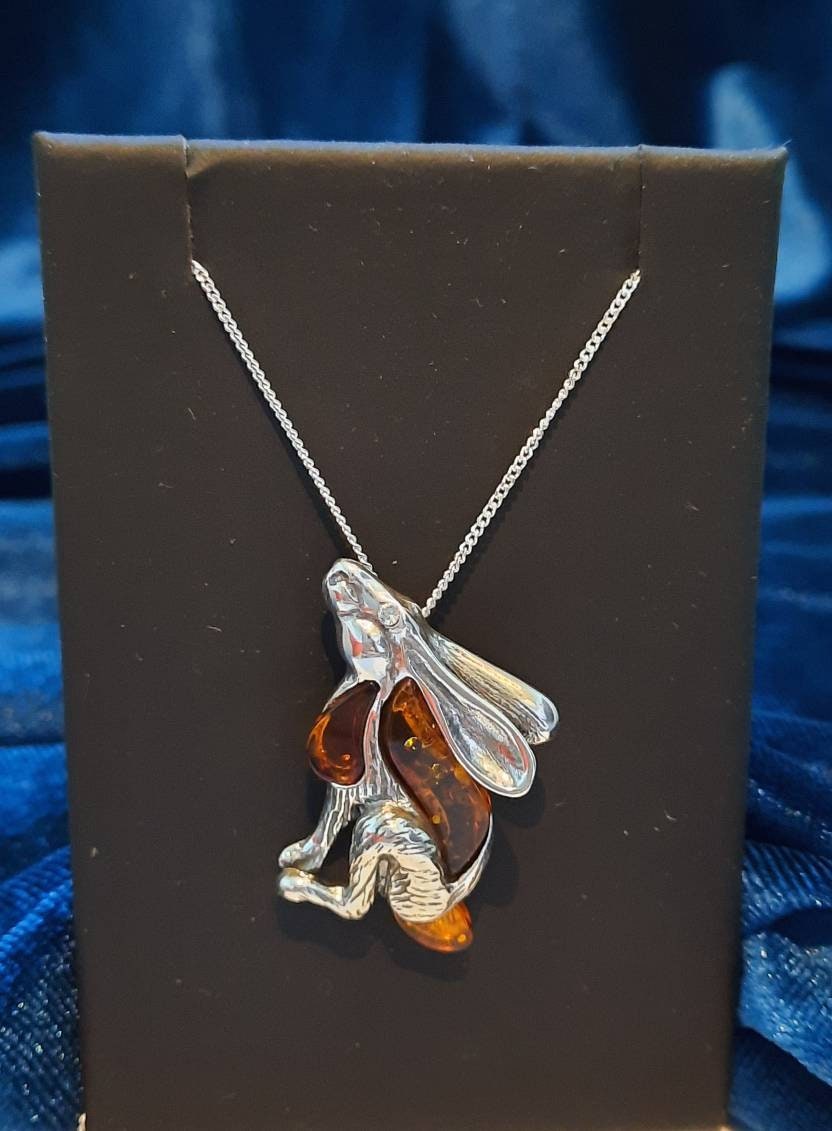 Beautifu designer sterling silver and cognac amber star gazing hare necklace