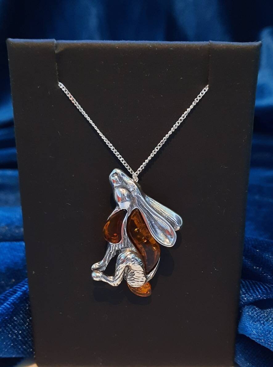Beautifu designer sterling silver and cognac amber star gazing hare necklace