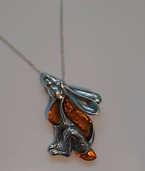 Beautifu designer sterling silver and cognac amber star gazing hare necklace