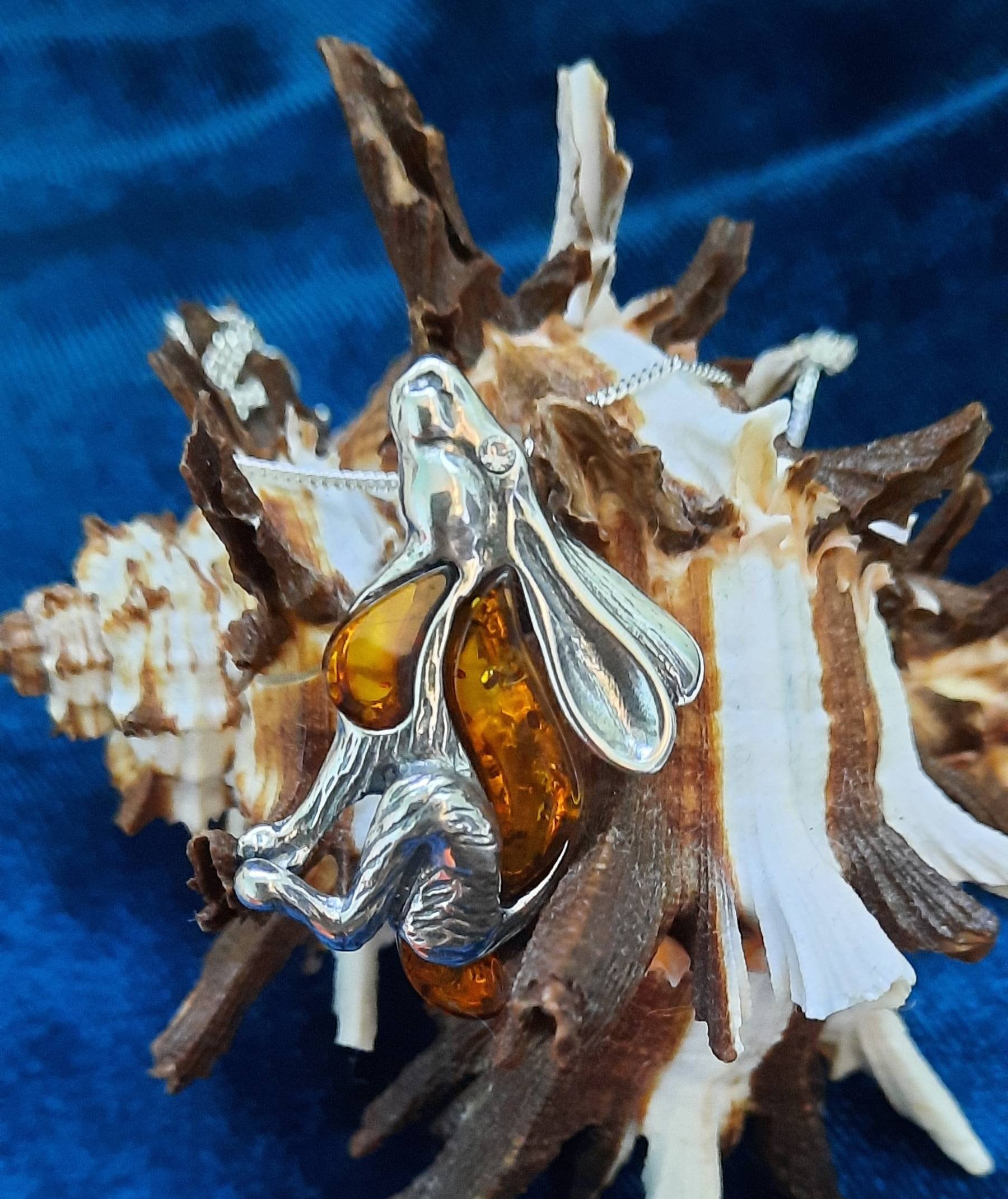 Beautifu designer sterling silver and cognac amber star gazing hare necklace